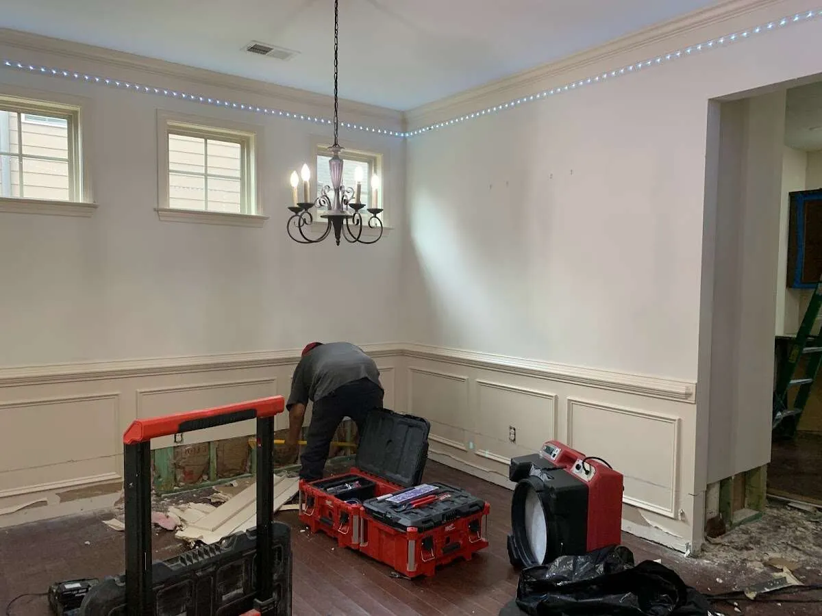 Restoration technician with professional equipment in Milton